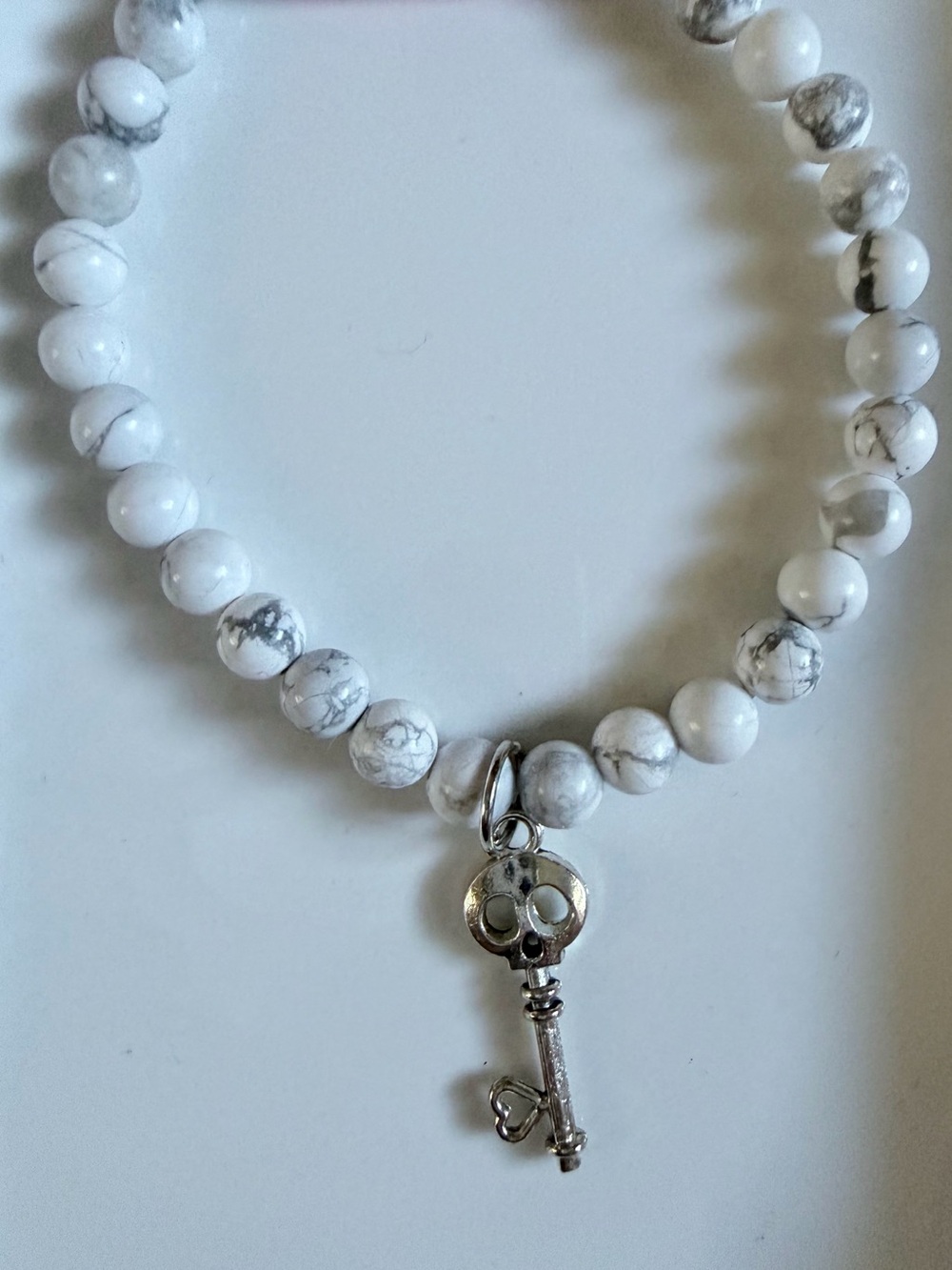 White Howlite Beaded Bracelet with Silver Key Charm